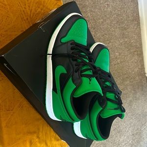 grenn on black jordan sneakers